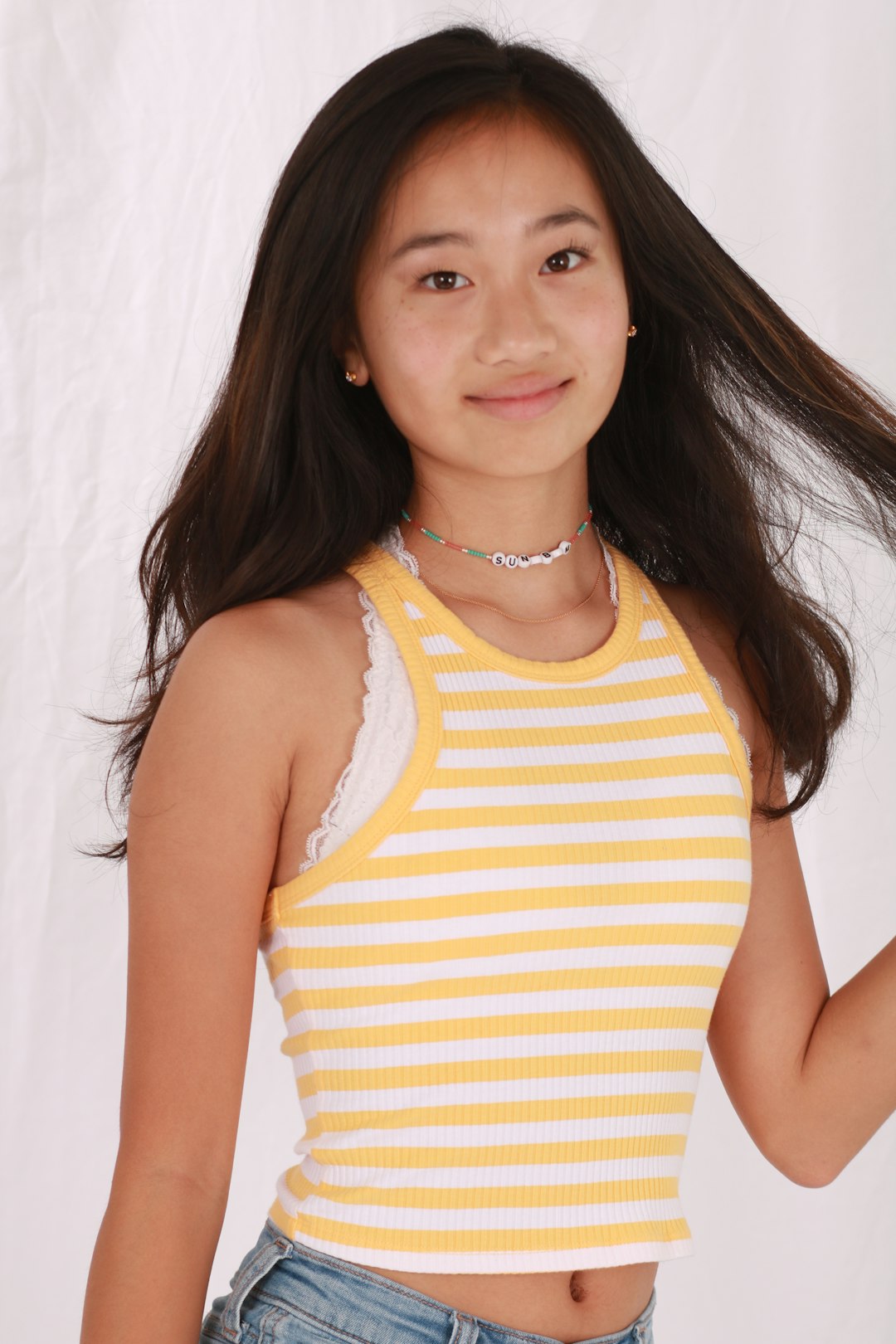 woman in green and white stripe tank top